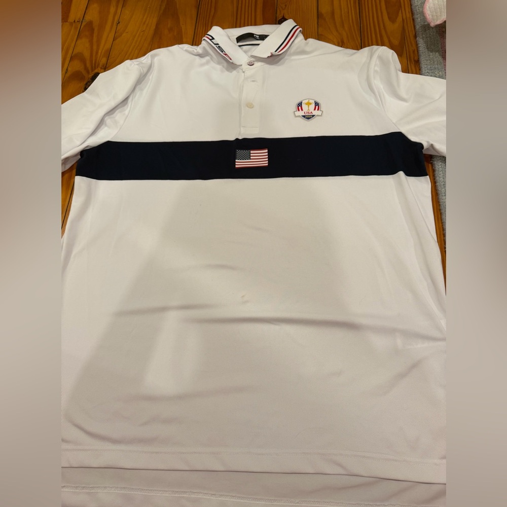 Authentic Ryder cup shirt. Stain showed on front. So cute